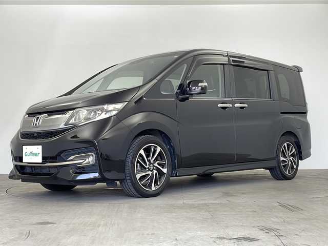 ホンダ ステップワゴン スパーダ クルスピセンシング 鹿児島県 2016(平28)年 5.4万km プレミアムスパークルブラックパール 純正ナビ/　(CD/DVD/USB/HDMI/Bluetooth)/フルセグTV/マルチビューカメラ/純正フリップダウンモニター/純正ドライブレコーダー/ステアリングスイッチ/パドルシフト/アダプティブクルーズコントロール/ホンダセンシング/　・衝突軽減ブレーキ/　・路外逸脱抑制システム/　・標識認識機能/アイドリングストップ/プッシュエンジンスタート/スマートキー×2/両側パワースライドドア/ハーフレザー調シート/前席シートヒーター/リア席サイドサンシェード/純正フロアマット/わくわくゲート/ドアバイザー/LEDヘッドライト/フォグランプ/オートライト/ウィンカー付き電動格納ミラー/取扱説明書/ナビ取扱説明書
