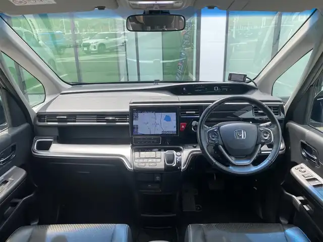 ホンダ ステップワゴン スパーダ ハイブリッド G EX ホンダセンシング 香川県 2018(平30)年 9.7万km プレミアムスパークルブラックパール 登録時走行距離：96394km/純正10型ナビ/　CD DVD BT　フルセグTV/純正11.6型フリップダウンモニター/全方位カメラ/両側パワースライドドア/ホンダセンシング/レーダークルーズコントロール/レーンキープアシスト/LEDヘッドライト/オートライト/フォグランプ/横滑り防止装置/ビルトインETC/ハーフレザーシート/シートヒーター/革巻きステアリング/ステアリングスイッチ/プッシュスタート/スマートキー/スペアキー