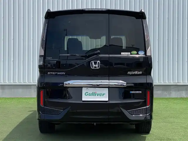 ホンダ ステップワゴン スパーダ ハイブリッド G EX ホンダセンシング 香川県 2018(平30)年 9.7万km プレミアムスパークルブラックパール 登録時走行距離：96394km/純正10型ナビ/　CD DVD BT　フルセグTV/純正11.6型フリップダウンモニター/全方位カメラ/両側パワースライドドア/ホンダセンシング/レーダークルーズコントロール/レーンキープアシスト/LEDヘッドライト/オートライト/フォグランプ/横滑り防止装置/ビルトインETC/ハーフレザーシート/シートヒーター/革巻きステアリング/ステアリングスイッチ/プッシュスタート/スマートキー/スペアキー