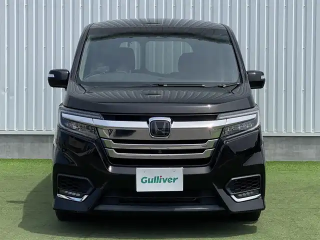 ホンダ ステップワゴン スパーダ ハイブリッド G EX ホンダセンシング 香川県 2018(平30)年 9.7万km プレミアムスパークルブラックパール 登録時走行距離：96394km/純正10型ナビ/　CD DVD BT　フルセグTV/純正11.6型フリップダウンモニター/全方位カメラ/両側パワースライドドア/ホンダセンシング/レーダークルーズコントロール/レーンキープアシスト/LEDヘッドライト/オートライト/フォグランプ/横滑り防止装置/ビルトインETC/ハーフレザーシート/シートヒーター/革巻きステアリング/ステアリングスイッチ/プッシュスタート/スマートキー/スペアキー