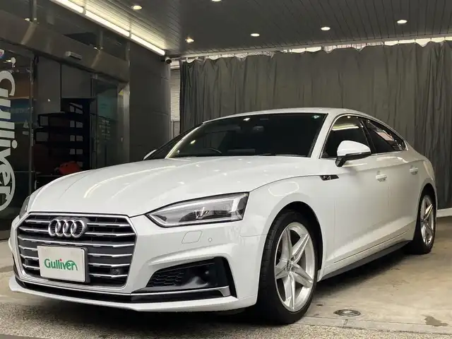 アウディ Ａ５ SB 2．0 TFSI スポーツ 東京都 2017(平29)年 3.3万km グレイシアホワイトメタリック 2000CCターボ/純正ナビゲーション/地上デジタルテレビ/Bカメラ/ETC DSRC/レーダークルーズコントロール/アクティブレーンアシスト/マトリクスLED/前席電動シート・シートヒーター/パワーバックドア/スマートキー/アイドリングストップ/アウディドライブセレクト/点検整備記録簿/・R23456年有/取扱説明書/純正アルミホイール18インチ/純正フロアマット