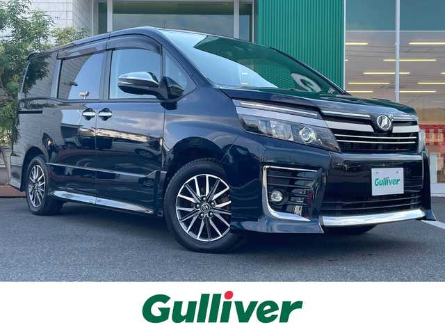 トヨタ ヴォクシー ZS 煌Ⅱ 岡山県 2016(平28)年 4.1万km ブラッキッシュアゲハガラスフレーク 純正10インチナビ　NSZN-Z66T/フルセグTV、CD、DVD、AM、FM、Bluetooth/バックカメラ/ビルトインETC/両側パワースライドドア/トヨタセーフティセンス/・プリクラッシュセーフティ/・レーンディパーチャーアラート/・オートマチックハイビーム/ドライブレコーダー