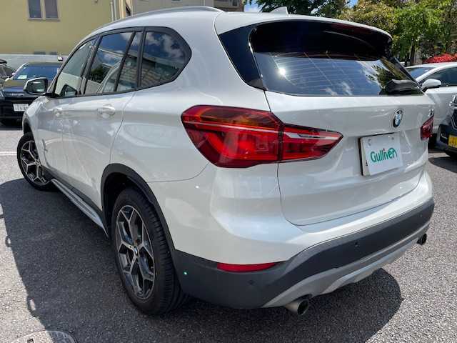 ＢＭＷ Ｘ１ xDrive 20i Xライン 東京都 2016(平28)年 5万km ミネラルホワイト 4WD/ダウンヒルアシスト/コンフォートパッケージ（・パワーバックドア・リアシートスライディング/バックレストリリース機能）/ドライビングアシスト（レーンディパーチャーウォーニング・前車接近警告機能・衝突回避/被害軽減ブレーキ）/ワンオーナー/保証書・取説・ナビ取説/Egプッシュスタート・スマートキー×2/ドライブモード/革巻きステア/ステアリングスチッチ/速度警告/黒ハーフレザーシート/純正HDDナビ/DVD/CD/BT/AUX/MSV/バックカメラ/ミラー一体型ETC/コーナーセンサー/純正１８インチアルミ/HID・オートライト・前後フォグ/ルーフレール/AUTOHOLD/横滑り防止装置/ウィンカーミラー/トノカバー
