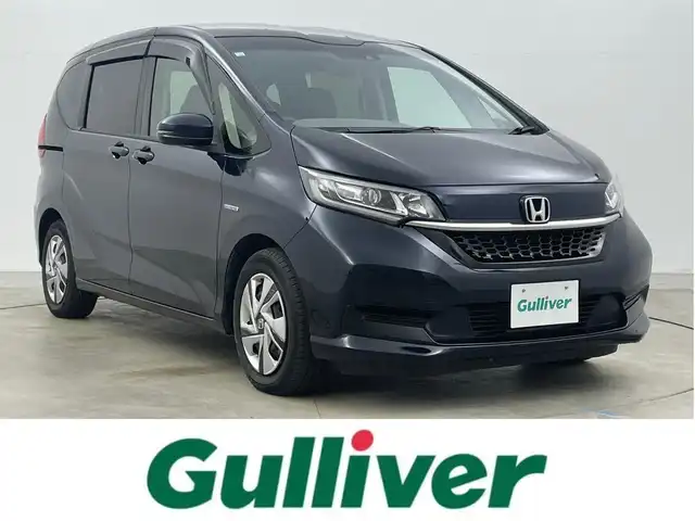ホンダ フリード ハイブリット G ホンダセンシング 岡山県 2020(令2)年 5.6万km ミッドナイトブルービームM 純正ナビ/【Bluetooth/フルセグTV/CD/DVD/USB接続】/型番:VXM-204VFi/バックカメラ/前席シートヒーター/両側パワースライドドア/ＬＥＤヘッドライト/ビルトインＥＴＣ/衝突軽減ブレーキ/レーダークルーズコントロール/ドアバイザー/純正フロアマット/プッシュスタート/スマートキー×1/取扱説明書/ナビ取扱説明書/新車保証書