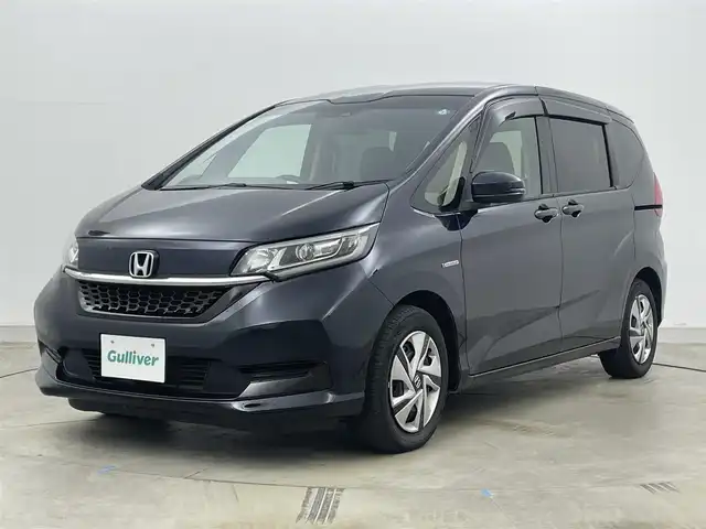 ホンダ フリード ハイブリット G ホンダセンシング 岡山県 2020(令2)年 5.6万km ミッドナイトブルービームM 純正ナビ/【Bluetooth/フルセグTV/CD/DVD/USB接続】/型番:VXM-204VFi/バックカメラ/前席シートヒーター/両側パワースライドドア/ＬＥＤヘッドライト/ビルトインＥＴＣ/衝突軽減ブレーキ/レーダークルーズコントロール/ドアバイザー/純正フロアマット/プッシュスタート/スマートキー×1/取扱説明書/ナビ取扱説明書/新車保証書
