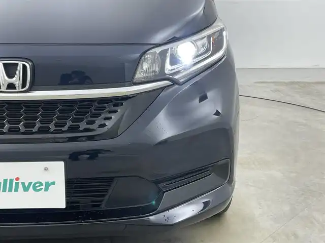 ホンダ フリード ハイブリット G ホンダセンシング 岡山県 2020(令2)年 5.6万km ミッドナイトブルービームM 純正ナビ/【Bluetooth/フルセグTV/CD/DVD/USB接続】/型番:VXM-204VFi/バックカメラ/前席シートヒーター/両側パワースライドドア/ＬＥＤヘッドライト/ビルトインＥＴＣ/衝突軽減ブレーキ/レーダークルーズコントロール/ドアバイザー/純正フロアマット/プッシュスタート/スマートキー×1/取扱説明書/ナビ取扱説明書/新車保証書
