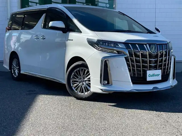 トヨタ アルファードハイブリット S タイプゴールド 青森県 2021(令3)年 8.4万km ホワイトパールクリスタルシャイン ワンオーナー/フロントモデリスタエアロ/メモリナビ/ワンセグテレビ/バックカメラ/フリップダウンモニター/ウィンカーミラー/クルーズコントロール/ドアバイザー/両側パワースライドドア/ETC/ウィンカーミラー/スタッドレスタイヤ車載/ドライブレコーダー/スペアキー1個