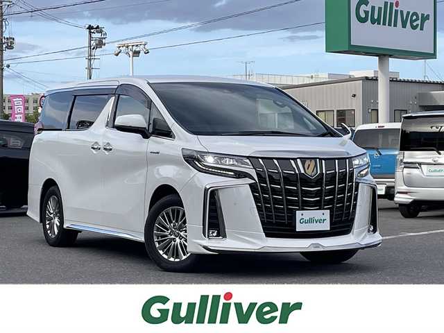 トヨタ アルファードハイブリット S タイプゴールド 青森県 2021(令3)年 8.4万km ホワイトパールクリスタルシャイン ワンオーナー/フロントモデリスタエアロ/メモリナビ/ワンセグテレビ/バックカメラ/フリップダウンモニター/ウィンカーミラー/クルーズコントロール/ドアバイザー/両側パワースライドドア/ETC/ウィンカーミラー/スタッドレスタイヤ車載/ドライブレコーダー/スペアキー1個