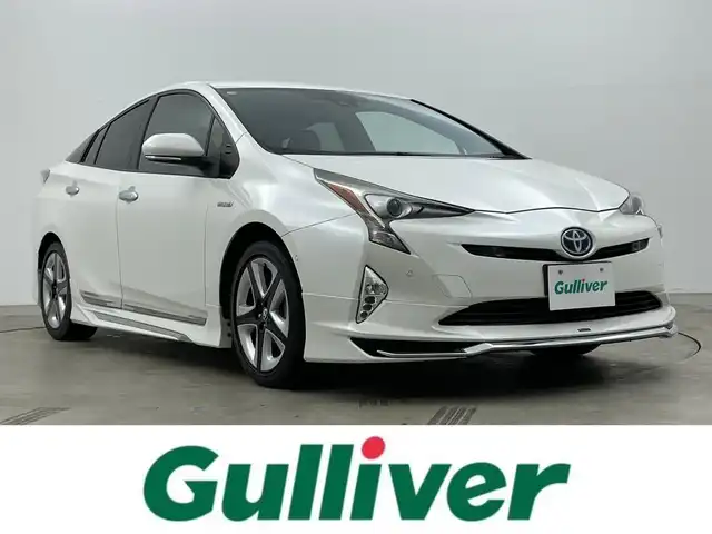 トヨタ プリウス A ツーリングセレクション 岡山県 2018(平30)年 7.3万km ホワイトパールクリスタルシャイン モデリスタエアロ/純正ナビ（NSZT-W68T）/・FM/AM/Bluetooth/フルセグ/CD/DVD/バックカメラ/合皮シート/・シートヒーター/HUD/パーキングアシスト/ドライブレコーダー/ETC/トヨタセーフティーセンス/・プリクラッシュセーフティ/・レーンディパーチャーアラート/・レーダークルーズコントロール/・オートマチックハイビーム/・コーナーセンサー/BSM/純正アルミ/純正フロアマット/新車保証書/取扱説明書/スペアキー×１