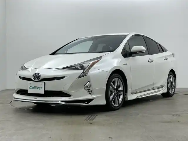 トヨタ プリウス A ツーリングセレクション 岡山県 2018(平30)年 7.3万km ホワイトパールクリスタルシャイン モデリスタエアロ/純正ナビ（NSZT-W68T）/・FM/AM/Bluetooth/フルセグ/CD/DVD/バックカメラ/合皮シート/・シートヒーター/HUD/パーキングアシスト/ドライブレコーダー/ETC/トヨタセーフティーセンス/・プリクラッシュセーフティ/・レーンディパーチャーアラート/・レーダークルーズコントロール/・オートマチックハイビーム/・コーナーセンサー/BSM/純正アルミ/純正フロアマット/新車保証書/取扱説明書/スペアキー×１