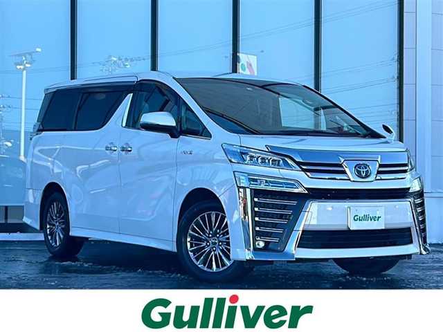 トヨタ ヴェルファイア ハイブリット ZR 山形県 2020(令2)年 5.8万km ホワイトパールクリスタルシャイン ４WD/衝突被害軽減システム/純正ナビ/（Bluetooth/CD/DVD/フルセグ)/バックカメラ/フリップダウンモニター/両側パワースライドドア/前席シートヒーター/エアシート/パワーバックドア/クルーズコントロール/ステアリングスイッチ/デジタルインナーミラー/ドライブレコーダー/ヘッドアップディスプレイ/ブラインドスポットモニター/レーンキープアシスト/オートLEDヘッドライト/フォグランプ/ETC/スマートキー/スペアキー/ドアバイザー/電動格納ミラー/取扱説明書/保証書