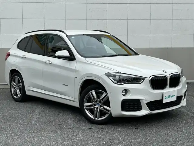 ＢＭＷ Ｘ１ sDrive 18i Mスポーツ 東京都 2017(平29)年 10.5万km アルピンホワイトⅢ ワンオーナー/純正HDDナビ/CD/DVD/FM・AM/Bluetooth//バックカメラ/衝突軽減ブレーキ/レーンディパーチャーアラート/前車接近警告/LIM/コーナーセンサー/ミラー型ETC2.0/純正フロアマット/純正18インチアルミホイール/LEDヘッドライト/フロントフォグランプ/パーキングアシスト/Mスポーツサスペンション/ハイグロスシャドーラインルーフレール/革巻きステアリングホイール/アイドリングストップ/保証書/取扱説明書/スペアキー