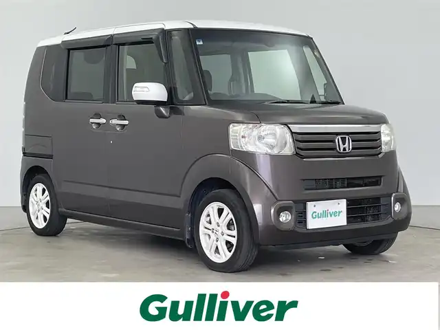 ホンダ Ｎ ＢＯＸ 2トーン SSパッケージ 大分県 2014(平26)年 8.3万km プレミアムブロンズパール 社外SDナビ（CNRE04D）/Bluetooth/CD/DVD/フルセグ/両側パワースライドドア/純正アルミホイル14インチ/純正フロアマット/バックカメラ/アイドリングストップ/プッシュスタート/スマートキー/スペアキー/ベンチシート/ETC/ステアリングスイッチ/取扱説明書