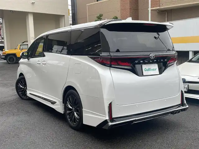 トヨタ ヴェルファイア Z プレミア 静岡県 2025(令7)年 0.1千km プラチナホワイトパールマイカ 登録時走行29km/ワンオーナー/モデリスタエアロ/左右独立ムーンルーフ/ユニバーサルステップ/寒冷地仕様/純正ナビ/フルセグTV/BT/USB/全方位カメラ/デジタルインナーミラー/黒革シート/両側パワースライドドア/パワーバックドア/シートヒーター/エアシート/置くだけ充電/プリクラッシュセーフティ/レーンディパーチャーアラート/レーダークルーズコントロール/オートハイビーム/ブラインドスポットモニター/クリアランスソナー/ヘッドアップディスプレイ/プロアクティブドライビングアシスト/ビルトインETC2.0/ステアリングヒーター/スマートキー×2/保証書/取扱説明書