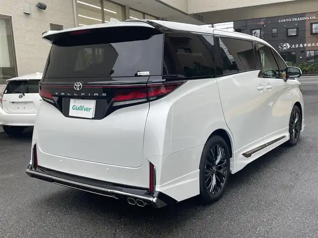トヨタ ヴェルファイア Z プレミア 静岡県 2025(令7)年 0.1千km プラチナホワイトパールマイカ 登録時走行29km/ワンオーナー/モデリスタエアロ/左右独立ムーンルーフ/ユニバーサルステップ/寒冷地仕様/純正ナビ/フルセグTV/BT/USB/全方位カメラ/デジタルインナーミラー/黒革シート/両側パワースライドドア/パワーバックドア/シートヒーター/エアシート/置くだけ充電/プリクラッシュセーフティ/レーンディパーチャーアラート/レーダークルーズコントロール/オートハイビーム/ブラインドスポットモニター/クリアランスソナー/ヘッドアップディスプレイ/プロアクティブドライビングアシスト/ビルトインETC2.0/ステアリングヒーター/スマートキー×2/保証書/取扱説明書