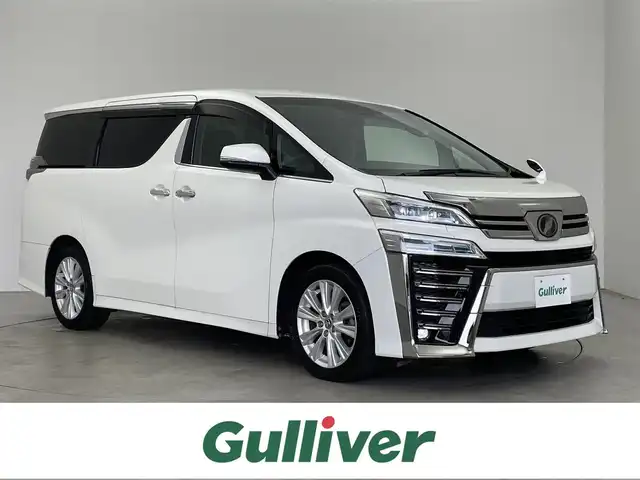 トヨタ ヴェルファイア Z Aエディション 埼玉県 2018(平30)年 5.1万km ホワイトパールクリスタルシャイン ALPINEナビ/後席モニター/バックカメラ/フルセグTV/Bluetooth/CD/DVD/ETC/両側パワースライドドア/衝突軽減ブレーキ/レーンキープアシスト/レーダークルーズコントロール/オートハイビーム/電動パーキングブレーキ/オットマン/純正フロアマット/純正18インチAW