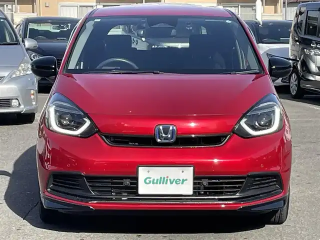 ホンダ フィット e:HEVホーム ブラックスタイル 群馬県 2024(令6)年 0.9万km プレミアムクリスタルレッドM ワンオーナー/純正ディスプレイオーディオ/バックカメラ/ホンダセンシング/ＬＥＤヘッドライト/純正ドライブレコーダー前後カメラ/ステアリングリモコン/スマートキー/保証書/取説/スペアキーｘ１