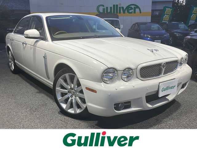 ジャガー ＸＪ 3．0 Executive 東京都 2009(平21)年 5.6万km ポーセリンホワイト DVDナビ/バックカメラ/クルーズコントロール/ETC/電動パーキングブレーキ/革シート/シートヒーター/バーウォールナット木目調インパネ/純正アルミホイール/パワーシート（D/N）/ハロゲンヘッドライト/横滑り防止装置/カーテンエアバック/盗難防止装置/