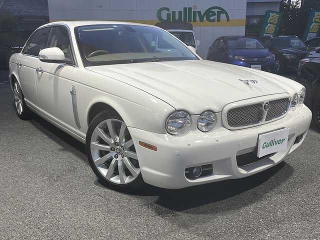 ジャガー ＸＪ 3．0 Executive 東京都 2009(平21)年 5.6万km ポーセリンホワイト DVDナビ/バックカメラ/クルーズコントロール/ETC/電動パーキングブレーキ/革シート/シートヒーター/バーウォールナット木目調インパネ/純正アルミホイール/パワーシート（D/N）/ハロゲンヘッドライト/横滑り防止装置/カーテンエアバック/盗難防止装置/