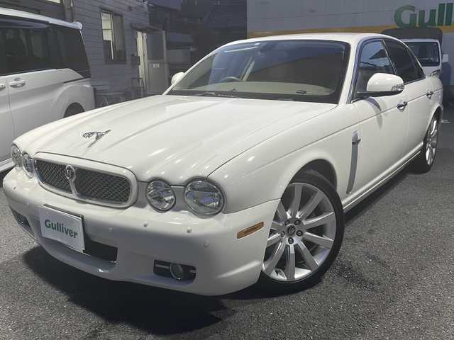 ジャガー ＸＪ 3．0 Executive 東京都 2009(平21)年 5.6万km ポーセリンホワイト DVDナビ/バックカメラ/クルーズコントロール/ETC/電動パーキングブレーキ/革シート/シートヒーター/バーウォールナット木目調インパネ/純正アルミホイール/パワーシート（D/N）/ハロゲンヘッドライト/横滑り防止装置/カーテンエアバック/盗難防止装置/