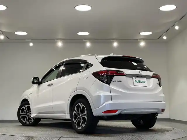 ホンダ ヴェゼル ハイブリッド Z ホンダセンシング 愛知県 2018(平30)年 5.1万km プラチナホワイトパール ワンオーナー/純正7型インターナビ/（Bluetooth/フルセグTV/SD/HDMI/CD・DVD再生/iPod/AUX/USB)/バックカメラ/ホンダセンシング/　　-衝突軽減ブレーキ（CMBS)/　　-路線逸脱抑制システム/　　-先行車発進お知らせ/　　-アダプティブクルーズコントロール/　　-誤発進抑制機能/前席シートヒーター/ビルトインETC/LEDヘッドライト/LEDフォグ/オートブレーキホールド機能/ルーフレール/プッシュスタート/　　-スマートキー/ハーフレザーシート/純正フロアマット/純正17インチAW