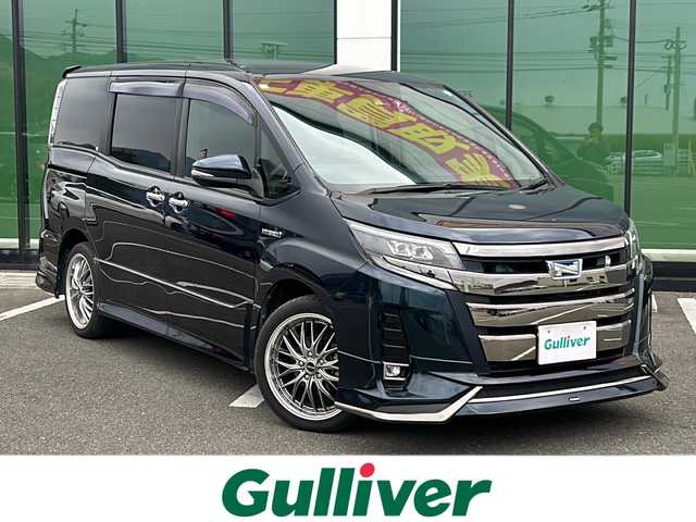 トヨタ ノア ハイブリッド Si ダブルバイビー 愛媛県 2018(平30)年 5.3万km ブラッキッシュアゲハガラスフレーク 外部検査実施済み/ワンオーナー/モデリスタエアロ/純正SDナビ【NSZN-Z61T】/(DVD/フルセグTV/Bluetooth/USB/MSV)/バックカメラ/フリップダウンモニター/両側パワースライドドア/TOYOTA Safety Sense/・レーダークルーズ コントロール/・プリクラッシュセーフティ/・レーントレーシングアシスト/・レーンディパーチャーアラート/・ロードサインアシスト/・先行車発進告知機能/・オートマチックハイビーム/前方ドライブレコーダー/ハーフレザーシート/前席シートヒーター/横滑り防止機能/スマートキー2個/プッシュスタート/LEDヘッドライト/ビルトインETC/新車時保証書/取扱説明書