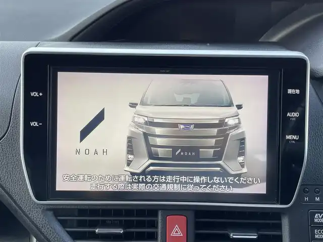 トヨタ ノア ハイブリッド Si ダブルバイビー 愛媛県 2018(平30)年 5.3万km ブラッキッシュアゲハガラスフレーク ワンオーナー/モデリスタエアロ/純正SDナビ【NSZN-Z61T】/(DVD/フルセグTV/Bluetooth/USB/MSV)/バックカメラ/フリップダウンモニター/両側パワースライドドア/TOYOTA Safety Sense/・レーダークルーズ コントロール/・プリクラッシュセーフティ/・レーントレーシングアシスト/・レーンディパーチャーアラート/・ロードサインアシスト/・先行車発進告知機能/・オートマチックハイビーム/前方ドライブレコーダー/ハーフレザーシート/前席シートヒーター/横滑り防止機能/スマートキー2個/プッシュスタート/LEDヘッドライト/ビルトインETC/新車時保証書/取扱説明書