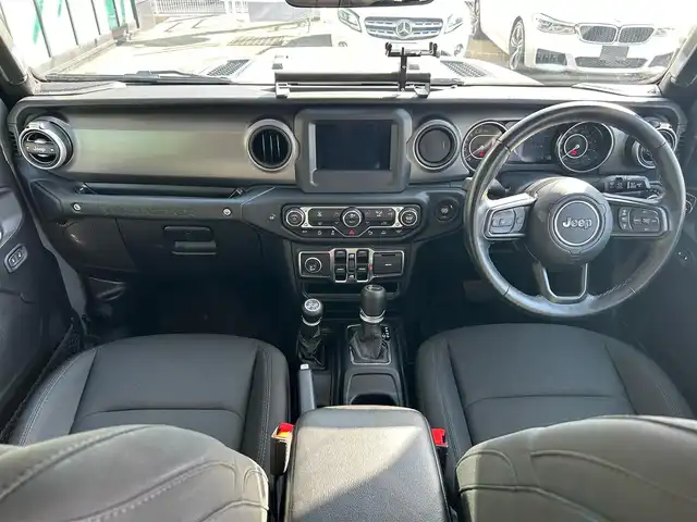 クライスラー・ジープ ジープ ラングラー アンリミテッド ウィリス 石川県 2021(令3)年 6.2万km グレー 4WD/ディスプレイオーディオ/Bluetooth・AM/FM・USB・AUX/車外カメラ（バック・フロント・サイド）/ETC/前後ドライブレコーダー/アダプティブクルーズコントロール/パーキングアシスト/アイドリングストップ/アンチロック・ブレーキ・システム/衝突被害軽減システム/横滑り防止装置/前後コーナーセンサー/センターデフロック/盗難防止装置/ダウンヒルアシストコントロール/エアバッグ（W+サイド）/純正アルミホイール/純正フロアマット/LEDヘッドライト/スマートキー/プッシュスタート