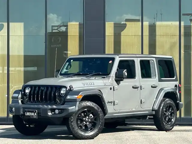 クライスラー・ジープ ジープ ラングラー アンリミテッド ウィリス 石川県 2021(令3)年 6.2万km グレー 4WD/ディスプレイオーディオ/Bluetooth・AM/FM・USB・AUX/車外カメラ（バック・フロント・サイド）/ETC/前後ドライブレコーダー/アダプティブクルーズコントロール/パーキングアシスト/アイドリングストップ/アンチロック・ブレーキ・システム/衝突被害軽減システム/横滑り防止装置/前後コーナーセンサー/センターデフロック/盗難防止装置/ダウンヒルアシストコントロール/エアバッグ（W+サイド）/純正アルミホイール/純正フロアマット/LEDヘッドライト/スマートキー/プッシュスタート