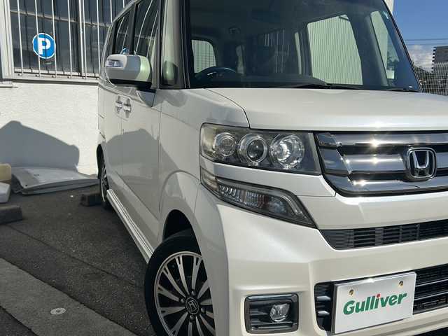 ホンダ Ｎ ＢＯＸ カスタム G ターボ Lパッケージ 富山県 2015(平27)年 14.2万km プレミアムホワイトパールⅡ ワンオーナー/両側パースライドドア/スマートキー×２/社外メモリーナビ(AIC-ZH0999L)/DVD/MSV/BT/デジタルTV/ETC/純正フルエアロ/皮巻きステアリング/ステアリングスイッチ/オートリトラミラー/パドルシフト/横滑り防止装置/電格ウィンカーミラー/クルーズコントロール/プッシュスタート/HIDヘッドライト/フォグ/リアロールシェイド/電格ウィーンカーミラ―/保証書・取説
