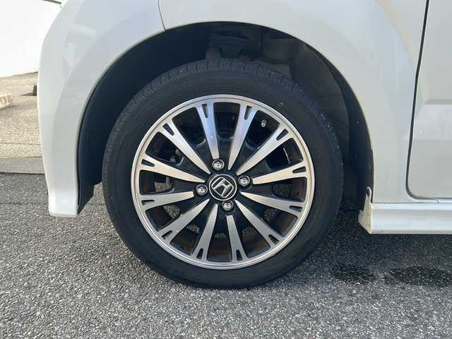 ホンダ Ｎ ＢＯＸ カスタム G ターボ Lパッケージ 富山県 2015(平27)年 14.2万km プレミアムホワイトパールⅡ ワンオーナー/両側パースライドドア/スマートキー×２/社外メモリーナビ(AIC-ZH0999L)/DVD/MSV/BT/デジタルTV/ETC/純正フルエアロ/皮巻きステアリング/ステアリングスイッチ/オートリトラミラー/パドルシフト/横滑り防止装置/電格ウィンカーミラー/クルーズコントロール/プッシュスタート/HIDヘッドライト/フォグ/リアロールシェイド/電格ウィーンカーミラ―/保証書・取説