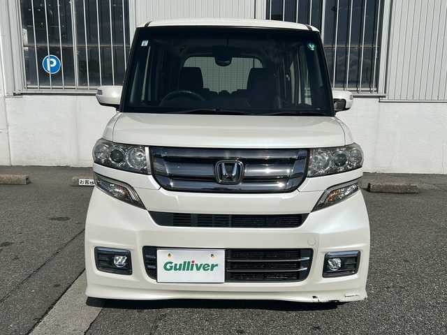 ホンダ Ｎ ＢＯＸ カスタム G ターボ Lパッケージ 富山県 2015(平27)年 14.2万km プレミアムホワイトパールⅡ ワンオーナー/両側パースライドドア/スマートキー×２/社外メモリーナビ(AIC-ZH0999L)/DVD/MSV/BT/デジタルTV/ETC/純正フルエアロ/皮巻きステアリング/ステアリングスイッチ/オートリトラミラー/パドルシフト/横滑り防止装置/電格ウィンカーミラー/クルーズコントロール/プッシュスタート/HIDヘッドライト/フォグ/リアロールシェイド/電格ウィーンカーミラ―/保証書・取説