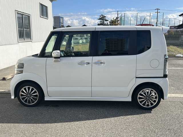 ホンダ Ｎ ＢＯＸ カスタム G ターボ Lパッケージ 富山県 2015(平27)年 14.2万km プレミアムホワイトパールⅡ ワンオーナー/両側パースライドドア/スマートキー×２/社外メモリーナビ(AIC-ZH0999L)/DVD/MSV/BT/デジタルTV/ETC/純正フルエアロ/皮巻きステアリング/ステアリングスイッチ/オートリトラミラー/パドルシフト/横滑り防止装置/電格ウィンカーミラー/クルーズコントロール/プッシュスタート/HIDヘッドライト/フォグ/リアロールシェイド/電格ウィーンカーミラ―/保証書・取説