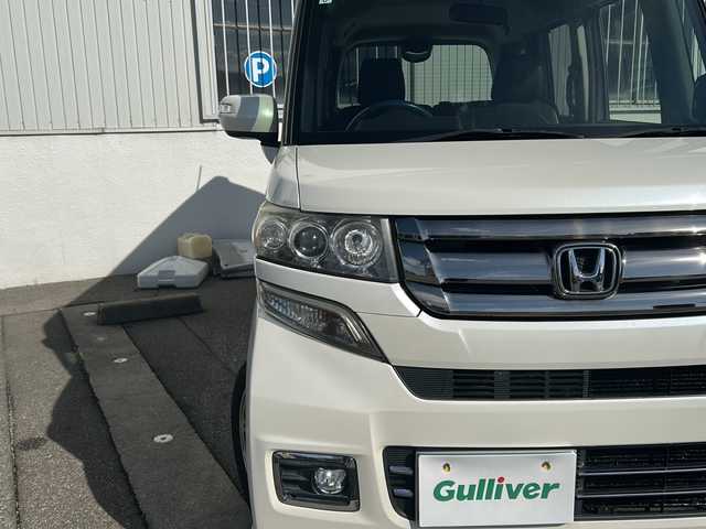 ホンダ Ｎ ＢＯＸ カスタム G ターボ Lパッケージ 富山県 2015(平27)年 14.2万km プレミアムホワイトパールⅡ ワンオーナー/両側パースライドドア/スマートキー×２/社外メモリーナビ(AIC-ZH0999L)/DVD/MSV/BT/デジタルTV/ETC/純正フルエアロ/皮巻きステアリング/ステアリングスイッチ/オートリトラミラー/パドルシフト/横滑り防止装置/電格ウィンカーミラー/クルーズコントロール/プッシュスタート/HIDヘッドライト/フォグ/リアロールシェイド/電格ウィーンカーミラ―/保証書・取説