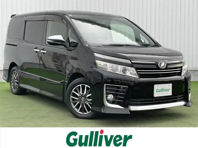 トヨタ ヴォクシー ZS 煌 香川県 2015(平27)年 8.9万km ブラック 禁煙車　/アルパインナビ【EX10】/(Bluetooth/FM/AM/DVD)/フルセグＴＶ　/アルパイン１０１型フリップダウンモニター　/バックカメラ　/両側電動スライドドア　/ＬＥＤライト　/フォグライト/オートライト/革巻きステアリング/ステアリングリモコン/純正１６インチアルミホイール　/純正フロアマット　/レーダー探知機【AR252GA】/ETC　/スマートキー/プッシュスタート　/ISOFIX