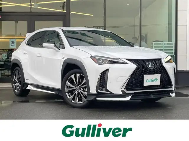 レクサス ＵＸ 250h Fスポーツ 東京都 2020(令2)年 1.6万km ホワイトノーヴァガラスフレーク TRDエアロ/TRDスポーツマフラー/TRDルーフスポイラー/3眼LEDヘッドライト/シートヒーター/ベンチレーションシート/ステアリングヒーター/純正ナビ/パノラミックビューモニター/パドルシフト/パワーバックドア/レクサスセーフティシステム＋/プリクラッシュセーフティ/レーントレーシングアシスト/オートマチックハイビーム/アダプティブハイビームシステム/ブラインドスポットモニター