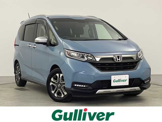 ホンダ フリード クロスター ホンダセンシング 愛知県 2021(令3)年 2万km シーグラスブルーパール 禁煙車/社外カロッツェリアナビ/(AM/FM/DVD/DISC/iPod/BT/USB/HDMI/フルセグ)/オートリトラミラー/ナビ装着用スペシャルパッケージ＋ETC/センターテーブル/CROSSTAR専用装備/ルーフレール/追従型クルーズコントロール/ドライブレコーダー前後/レーンキープアシスト/衝突軽減システム/横揺れ防止装置/プッシュスタート/スマートキー/スペアキー/オートライト/ウィンカー付き電格ミラー/ステアリングスイッチ/ドアバイザー/純正フロアマット/バニティーミラー/取扱説明書/ナビ取扱説明書/保証書