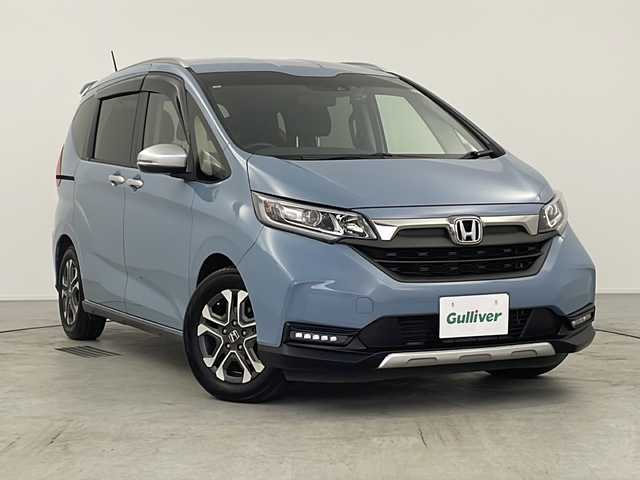 ホンダ フリード クロスター ホンダセンシング 愛知県 2021(令3)年 2万km シーグラスブルーパール 禁煙車/社外カロッツェリアナビ/(AM/FM/DVD/DISC/iPod/BT/USB/HDMI/フルセグ)/オートリトラミラー/ナビ装着用スペシャルパッケージ＋ETC/センターテーブル/CROSSTAR専用装備/ルーフレール/追従型クルーズコントロール/ドライブレコーダー前後/レーンキープアシスト/衝突軽減システム/横揺れ防止装置/プッシュスタート/スマートキー/スペアキー/オートライト/ウィンカー付き電格ミラー/ステアリングスイッチ/ドアバイザー/純正フロアマット/バニティーミラー/取扱説明書/ナビ取扱説明書/保証書