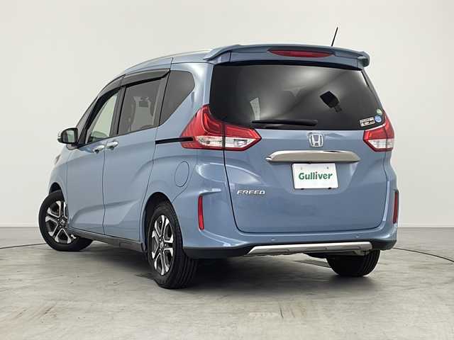 ホンダ フリード クロスター ホンダセンシング 愛知県 2021(令3)年 2万km シーグラスブルーパール 禁煙車/社外カロッツェリアナビ/(AM/FM/DVD/DISC/iPod/BT/USB/HDMI/フルセグ)/オートリトラミラー/ナビ装着用スペシャルパッケージ＋ETC/センターテーブル/CROSSTAR専用装備/ルーフレール/追従型クルーズコントロール/ドライブレコーダー前後/レーンキープアシスト/衝突軽減システム/横揺れ防止装置/プッシュスタート/スマートキー/スペアキー/オートライト/ウィンカー付き電格ミラー/ステアリングスイッチ/ドアバイザー/純正フロアマット/バニティーミラー/取扱説明書/ナビ取扱説明書/保証書