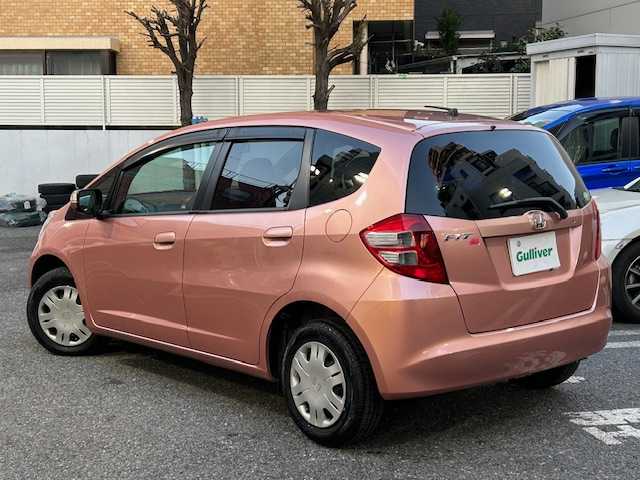 ホンダ フィット シーズ 東京都 2010(平22)年 7.7万km ピンクゴールドメタリック 純正ナビHDDナビ/フルセグ/DVD再生機能有/CD・SD・AM・FM/スタッドレスタイヤホイール4本セット/ETC/ドアバイザー/純正フロアマット/取扱説明書/記録簿