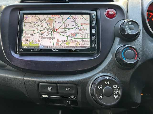 ホンダ フィット シーズ 東京都 2010(平22)年 7.7万km ピンクゴールドメタリック 純正ナビHDDナビ/フルセグ/DVD再生機能有/CD・SD・AM・FM/スタッドレスタイヤホイール4本セット/ETC/ドアバイザー/純正フロアマット/取扱説明書/記録簿