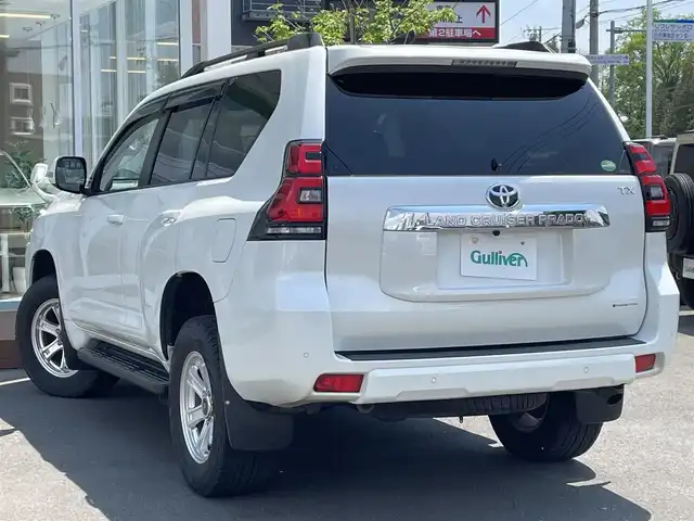 トヨタ ランドクルーザー プラド TX 道央・札幌 2018(平30)年 4万km ホワイトパールクリスタルシャイン ・４WD/・衝突軽減ブレーキ/・寒冷地仕様/・サンルーフ/・純正SDナビ/　CD＆DVD＆BT＆TV/・バックカメラ/・ディーゼルターボ/・レーンキープアシスト/・レーダークルーズコントロール/・コーナーセンサー/・ダウンヒルアシスト/・ビルトインETC/・MT付きAT/・ワイパー熱線/・オートエアコン/・オートライト/・オートハイビーム/・プッシュスタート/・スマートキー/・純正AW＆夏タイヤ積込/　265/65/17 2018年製/・社外フロアマット/・LEDヘッドライト/・ウィンカーミラー/・ルーフレール/・フォグライト