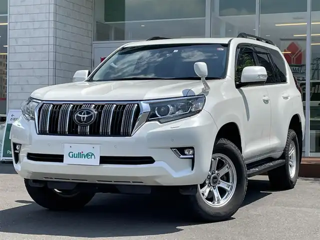 トヨタ ランドクルーザー プラド TX 道央・札幌 2018(平30)年 4万km ホワイトパールクリスタルシャイン ・４WD/・衝突軽減ブレーキ/・寒冷地仕様/・サンルーフ/・純正SDナビ/　CD＆DVD＆BT＆TV/・バックカメラ/・ディーゼルターボ/・レーンキープアシスト/・レーダークルーズコントロール/・コーナーセンサー/・ダウンヒルアシスト/・ビルトインETC/・MT付きAT/・ワイパー熱線/・オートエアコン/・オートライト/・オートハイビーム/・プッシュスタート/・スマートキー/・純正AW＆夏タイヤ積込/　265/65/17 2018年製/・社外フロアマット/・LEDヘッドライト/・ウィンカーミラー/・ルーフレール/・フォグライト