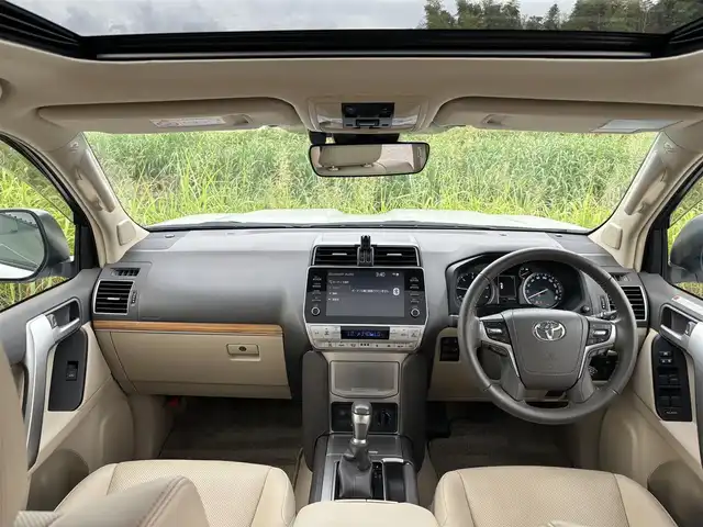 トヨタ ランドクルーザー プラド TX Lパッケージ マットブラED 奈良県 2023(令5)年 3万km ホワイトパールクリスタルシャイン 純正９インチメモリナビ　/フルセグ/サンルーフ　/レザーシート　/ブラインドスポットモニター　/全方位カメラ　/シートヒーター　/エアシート　/パワーシート　/Ｂｌｕｅｔｏｏｔｈ　/追従クルーズコントロール　/電動格納サードシート/パーキングサポートブレーキ/ETC2.0/ヘッドライトウォッシャー/センサーデフロック
