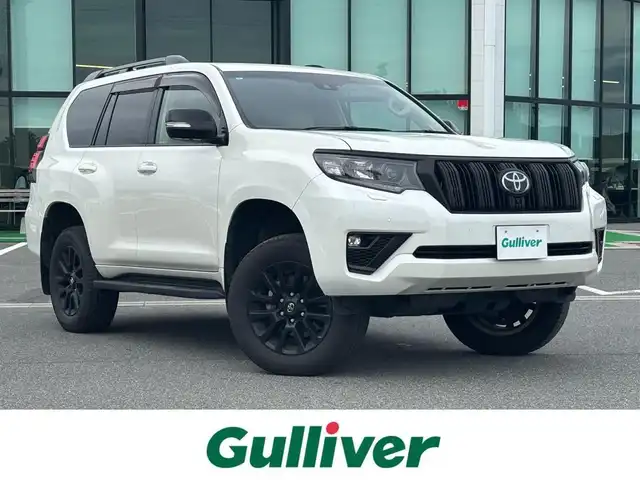 トヨタ ランドクルーザー プラド TX Lパッケージ マットブラED 奈良県 2023(令5)年 3万km ホワイトパールクリスタルシャイン 純正９インチメモリナビ　/フルセグ/サンルーフ　/レザーシート　/ブラインドスポットモニター　/全方位カメラ　/シートヒーター　/エアシート　/パワーシート　/Ｂｌｕｅｔｏｏｔｈ　/追従クルーズコントロール　/電動格納サードシート/パーキングサポートブレーキ/ETC2.0/ヘッドライトウォッシャー/センサーデフロック