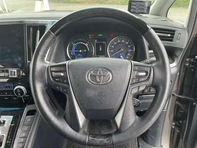 トヨタ アルファードハイブリット SR Cパッケージ 富山県 2019(平31)年 7.7万km グラファイトM 4WD/ツインムーンルーフ/アルパインナビ/フルセグTV/両側パワースライドドア/パワーバックドア/バックモニター/ビルトインETC/ドライブレコーダー/アルパイン12.8型リアビジョン/レーダークルーズコントロール/インテリジェントクリアランスソナー/セーフティセンス/・プリクラッシュセーフティ/・レーントレーシングアシスト/・ロードサインアシスト/・アダプティブハイビームシステム/純正OP3眼LEDヘッドランプ/デュアルオートエアコン/木目調/革巻きコンビステアリング/本革シート/前席パワーシート/快適温熱シート/助手席パワーオットマン/2列目エグゼクティブパワーシート/純正17インチアルミホイール/スマートエントリー/プッシュスタートシステム/ウェルカムパワースライドドア機能付/禁煙車