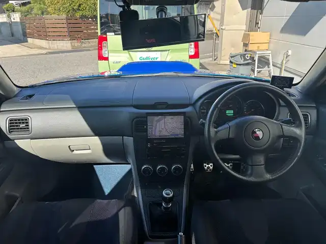 スバル フォレスター STi バージョン 愛知県 2005(平17)年 14.4万km WRブルーマイカ 4WD/6速MT/バックカメラ/社外ナビ/AM/FM/AUX/DVD/ETC/ルーフレール/電格ミラー/前後ドライブレコーダー/純正アルミホイール/ＳＴｉスポイラー　　/ブレンボブレーキキャリパー/社外マフラー/スペアキー