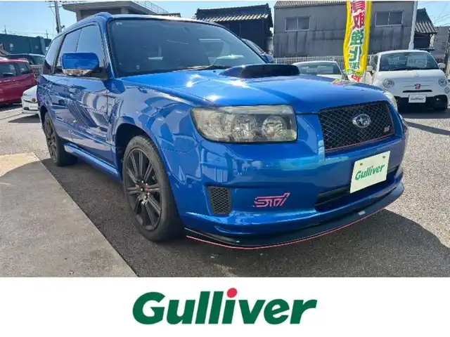 スバル フォレスター STi バージョン 愛知県 2005(平17)年 14.4万km WRブルーマイカ 4WD/6速MT/バックカメラ/社外ナビ/AM/FM/AUX/DVD/ETC/ルーフレール/電格ミラー/前後ドライブレコーダー/純正アルミホイール/ＳＴｉスポイラー　　/ブレンボブレーキキャリパー/社外マフラー/スペアキー