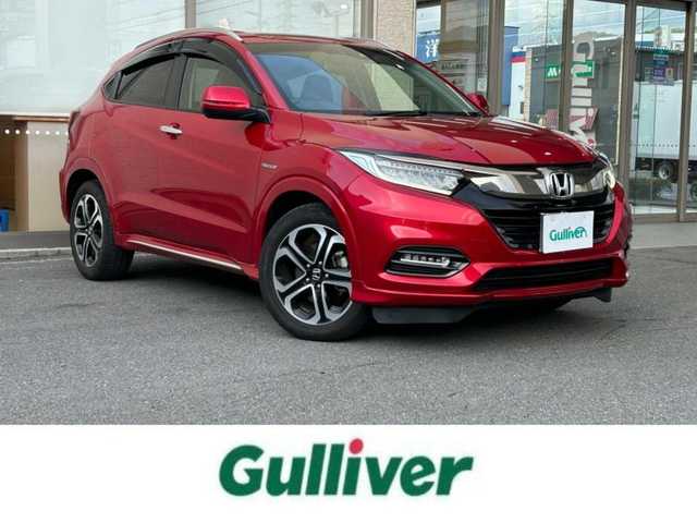 ホンダ ヴェゼル ハイブリッド Z ホンダセンシング 大阪府 2018(平30)年 10万km プレミアムクリスタルレッドM １オーナー/純正ナビ/（フルセグ／ＢＴ／ＣＤ／ＤＶＤ）/バックカメラ/クルーズコントロール/衝突被害軽減システム/レーンキープアシスト/横滑り機能/ハーフレザーシート/前席シートヒーター/純正ＡＷ/純正フロアマット/ドラレコ/ＥＴＣ