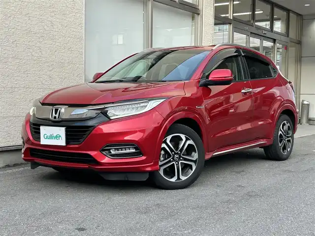 ホンダ ヴェゼル ハイブリッド Z ホンダセンシング 大阪府 2018(平30)年 10万km プレミアムクリスタルレッドM １オーナー/純正ナビ/（フルセグ／ＢＴ／ＣＤ／ＤＶＤ）/バックカメラ/クルーズコントロール/衝突被害軽減システム/レーンキープアシスト/横滑り機能/ハーフレザーシート/前席シートヒーター/純正ＡＷ/純正フロアマット/ドラレコ/ＥＴＣ